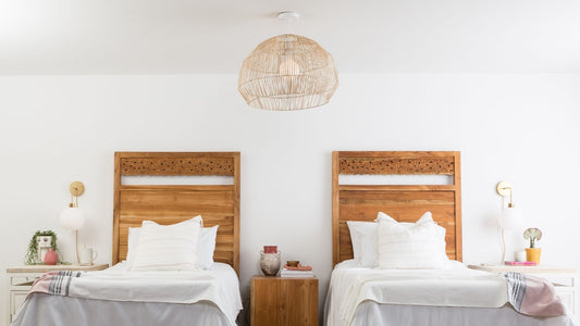 Bedroom with two twin beds and Color Cord plug-in sconces with hardwired natural shade pendant light overhead