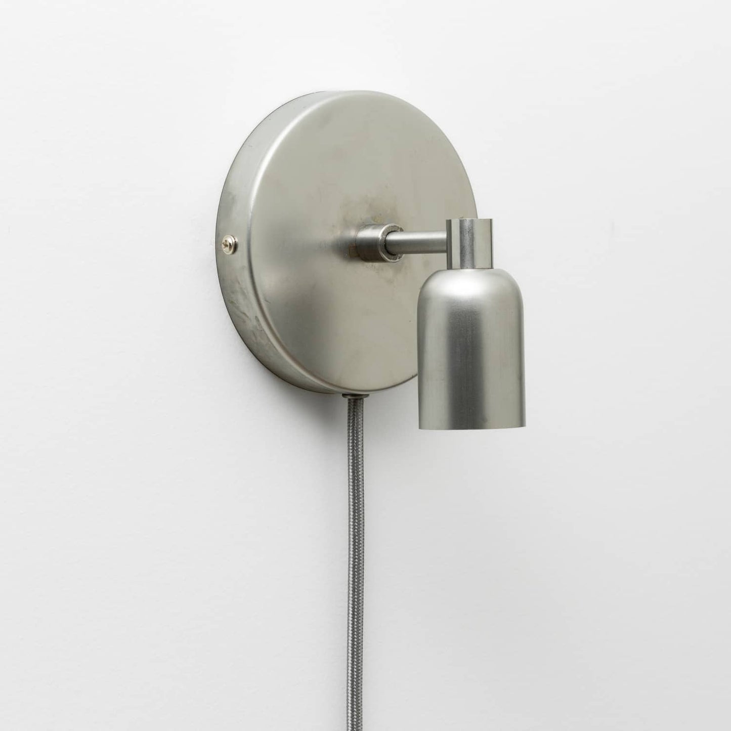 Junction Mini Solo Plug-In Sconce in Raw Metal finish 