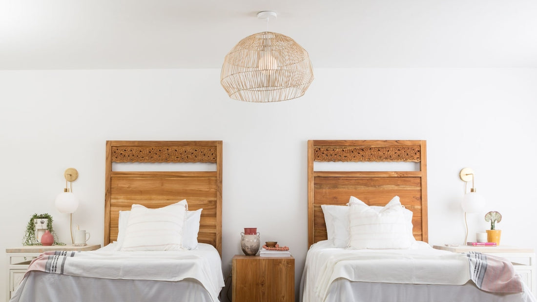 Bedroom with two twin beds and Color Cord plug-in sconces with hardwired natural shade pendant light overhead