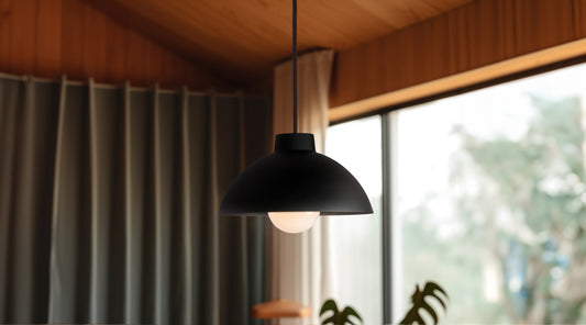 Color Cord’s dome metal pendant shade fixture in matte black in a modern dining room