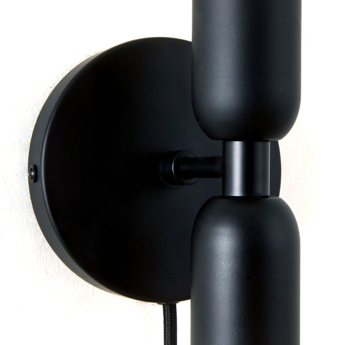 Close-up photo of Junction Mini Duo Plug-In Sconce in Matte Black finish