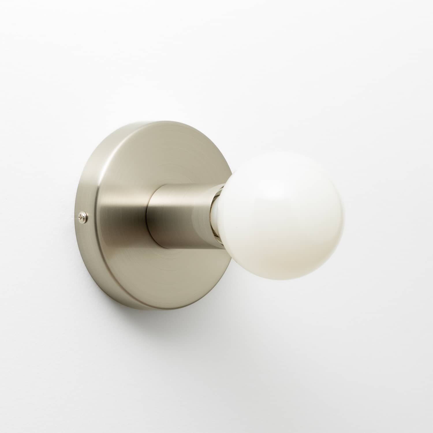 Button Light in Brushed Nickel finish pictured with G25 milk glass light bulb