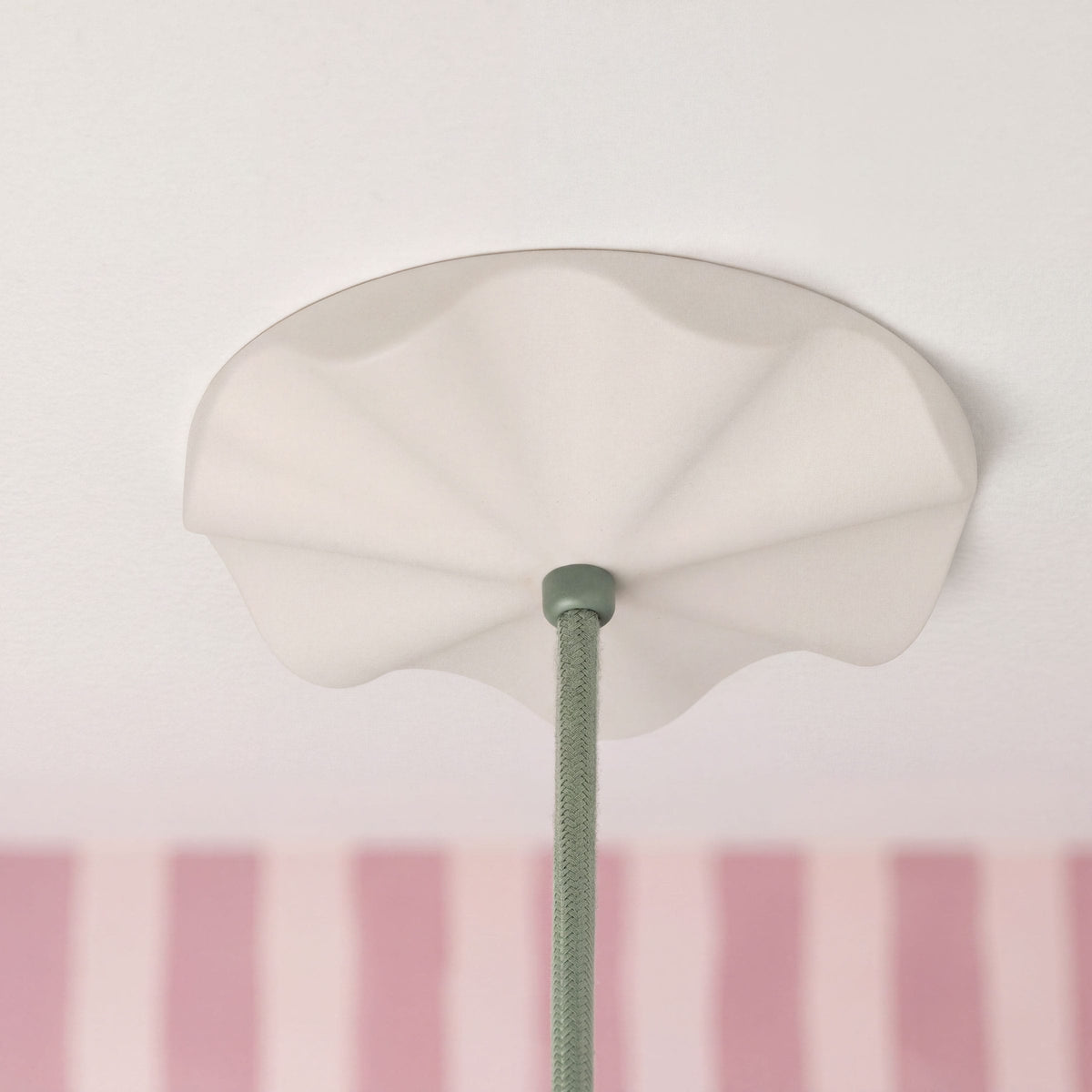 Fleur No. 12 porcelain pendant light with Sage cord and hardware in a home setting