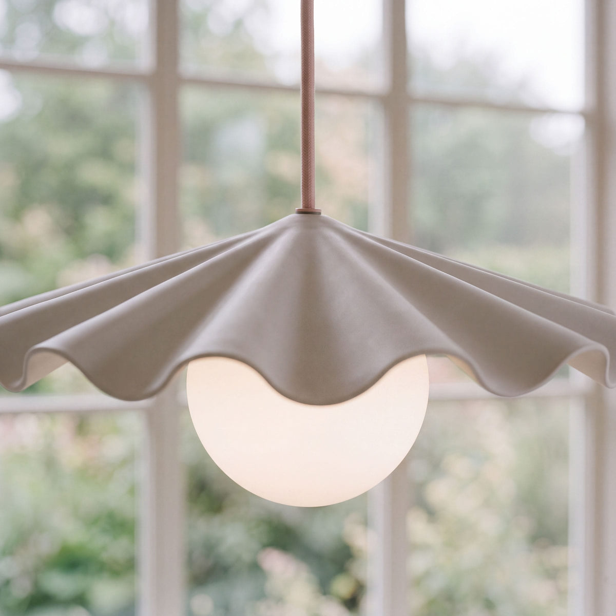 Fleur No. 3 porcelain pendant light with Quartz cord and hardware in a home setting