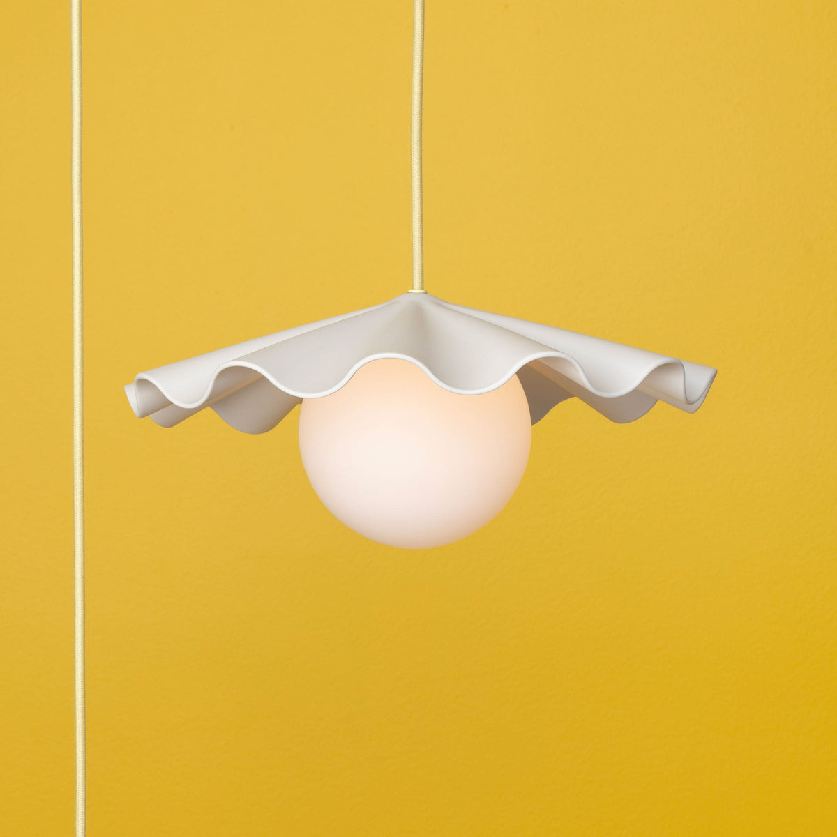 Fleur No. 3 plug-in porcelain pendant light with Pale Yellow cord and hardware, fluted raw porcelain shade
