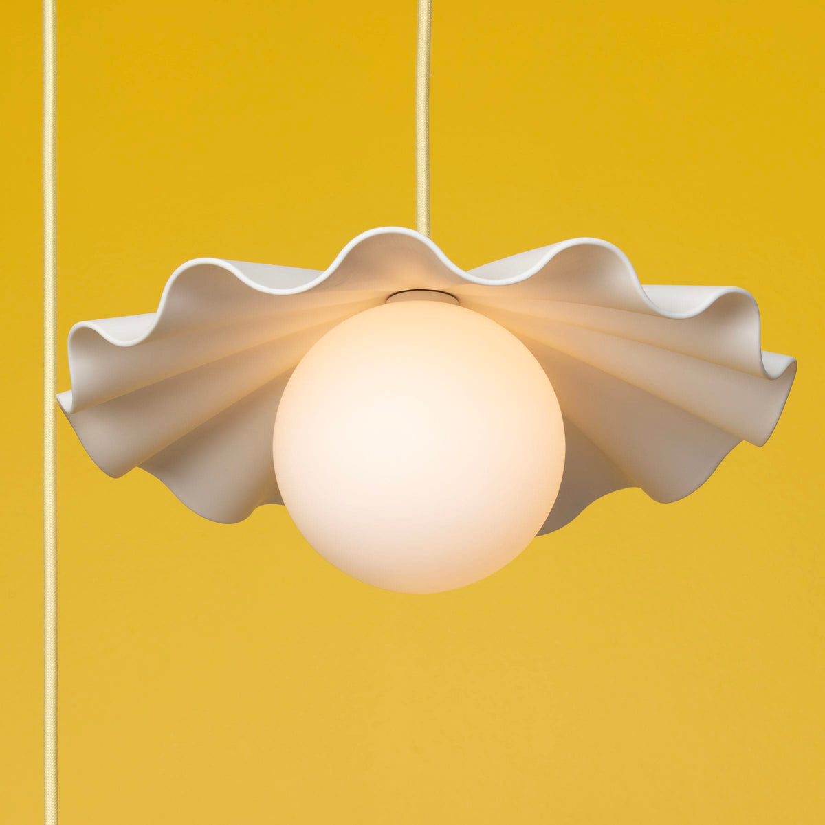 Fleur No. 3 plug-in porcelain pendant light with Pale Yellow cord and hardware, fluted raw porcelain shade
