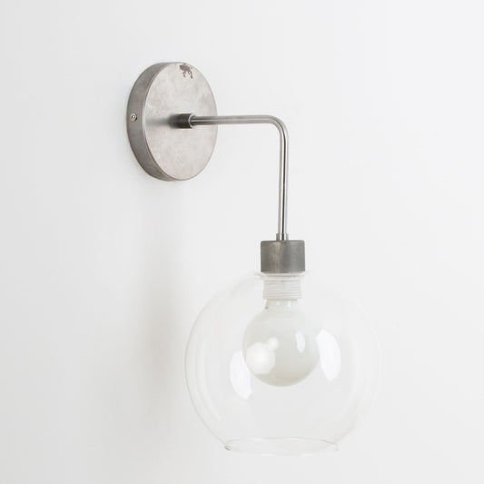 Bend Solo 8in Globe Sconce Raw Metal / Clear