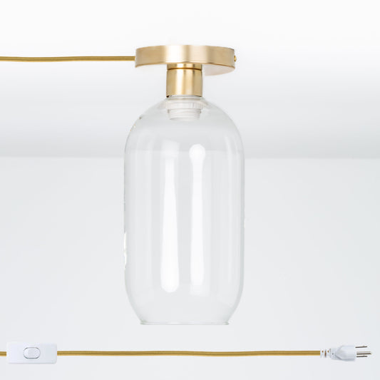 Plug-In Glass Pill Button Light Solid Raw Brass / Clear / Matching